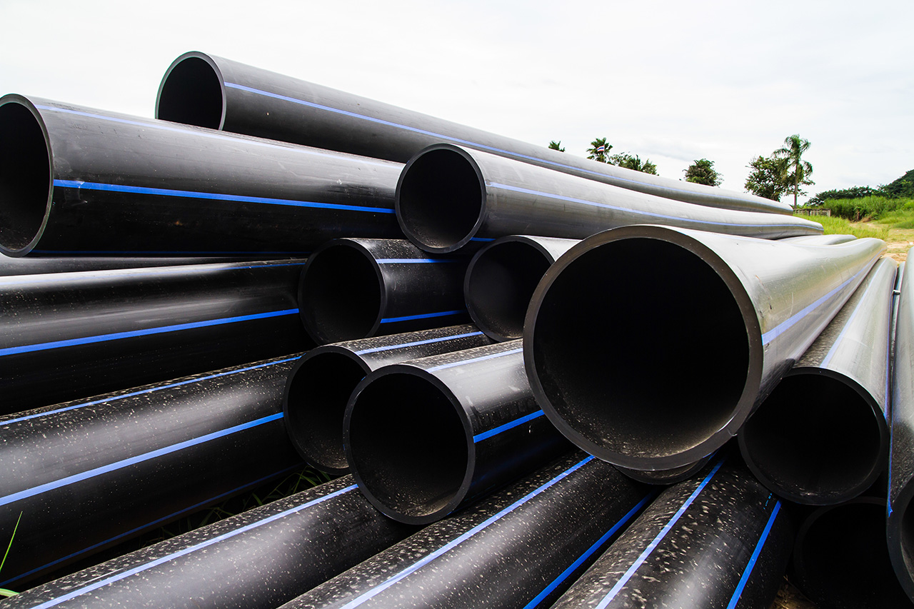 a stack of industrial hdpe pipe in an outdoor application