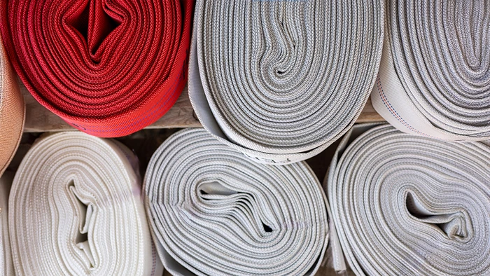 Rolls of lay-flat hoses used for transporting water and other liquids