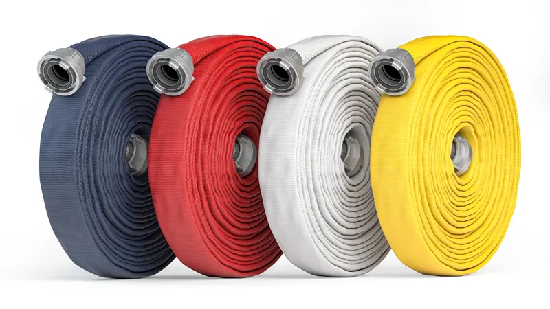Coiled fire hoses in blue, red, white, and yellow with couplings attached