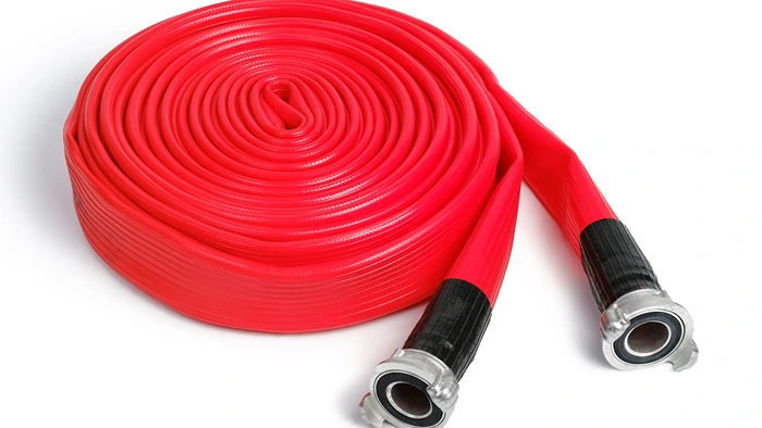 Rolled red fire hose with reinforced rubber lining for high-pressure water transfer