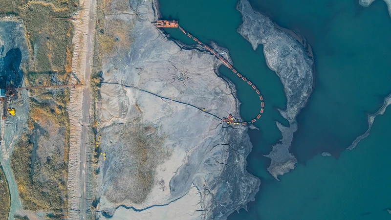 Mining dredging operation managing tailings pond