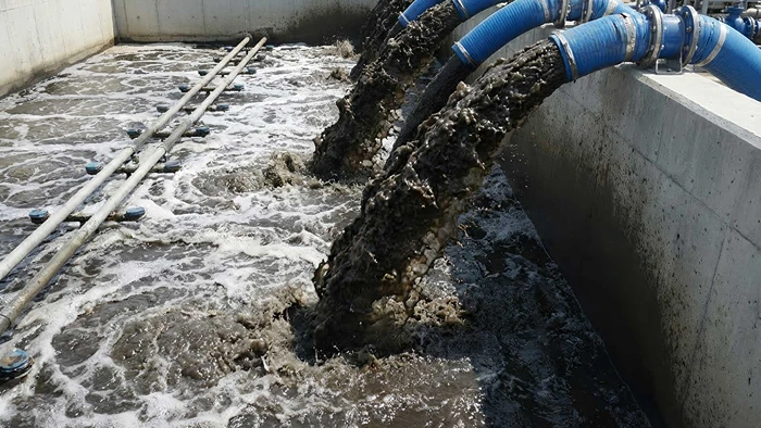 Wastewater transfer through blue pipes into aeration