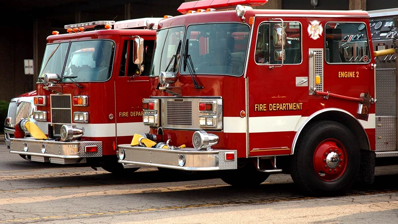 Municipal fire department using firefighting Lay Flat hose for high-pressure water delivery