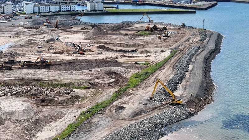 Aerial view of a mining operation with mountains around