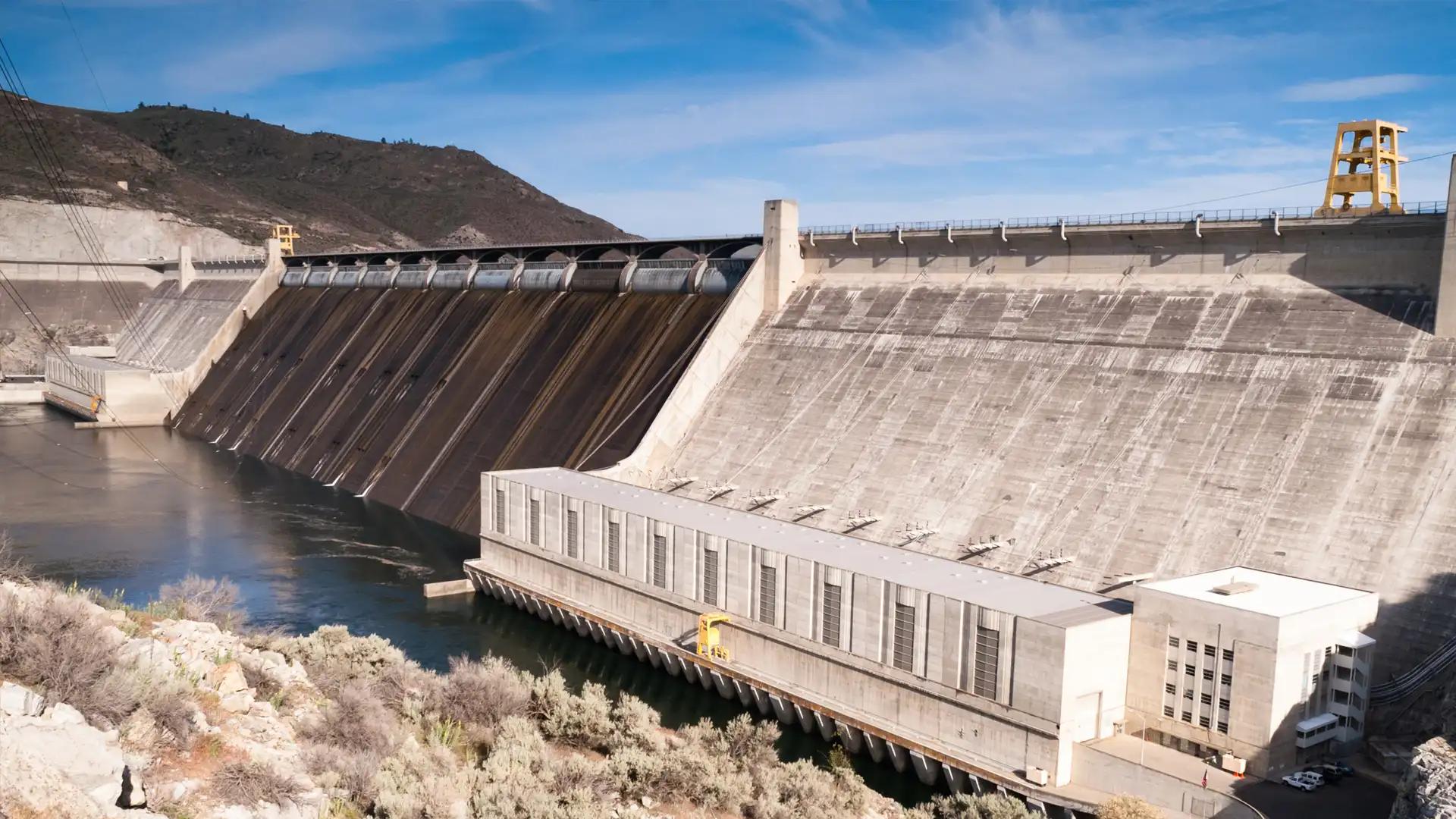 Power generation facility with high-performance piping systems supporting cooling water circulation, auxiliary processes, and continuous plant operations